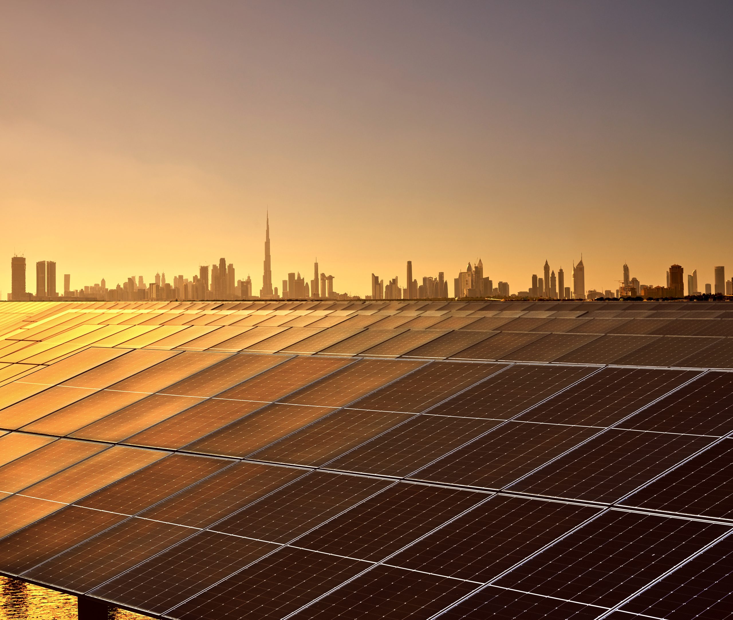 Dubai Skyline and Solar Panels at Sunset, United Arab Emirates
